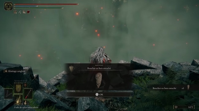 Bouclier en bois entaché